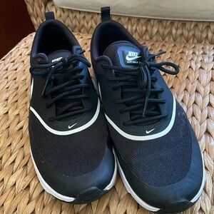 Women’s black Nike sneakers